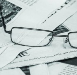 newspaper and glasses
